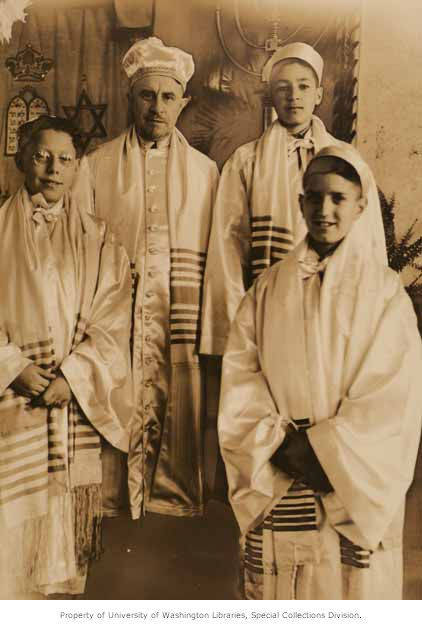 Rabbi Isidore Kahan (2nd from left) with bar mitsva boys Leon Uziel, Moe Azose, and Meyer Varon at Sephardic Bikur Cholim in Seattle, WA