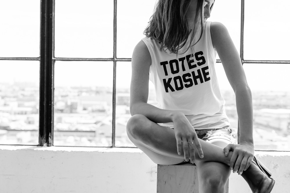 The "Unkosher Market" line of sleeveless T's has Yiddishy, slangy slogans like "Totes Koshe." Photograph: Neph & Becky Trejo