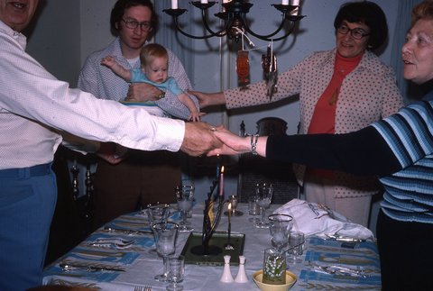 The author's first Chanukkah, which was also Shabbat and the day after Thanksgiving 1975, with Grandparents Henry, Estelle, Ethel, David and Sarah, six months old.