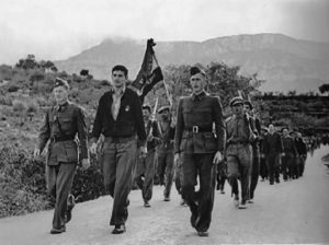 A young George Watt marches with his unit in Spain