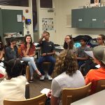 Students participate in a classroom discussion