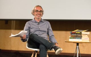 Author Gary Shteyngart smiles winningly at the audience after reading a manuscript copy of his memoir, "Little Failure"