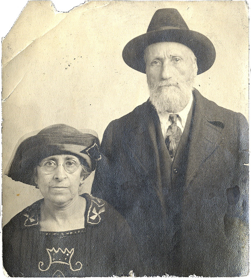 Photo of David and Kaden Alhadeff. They are both wearing hats; he is on the right standing and she is sitting at left.