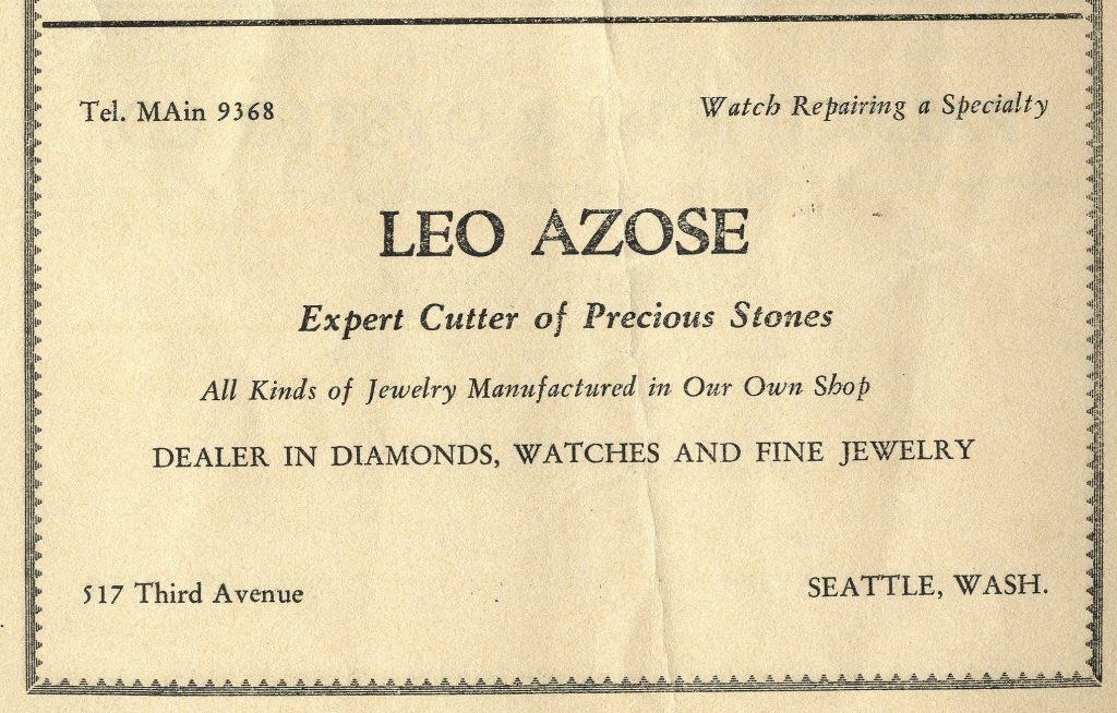 English language advertisement for Leo Azose's jewelry store with a decorative border.