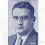 Black and white headshot of a young Solomon Maimon wearing a suit jacket and tie.
