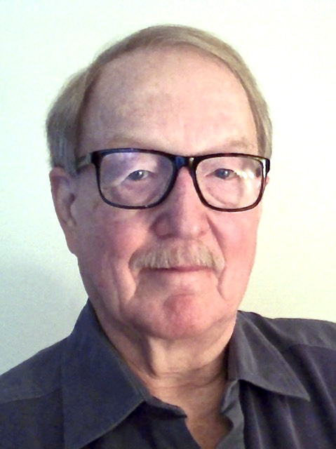 Alan Dowty, wearing glasses, against a white background