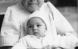 B&W photo of nona Beya "Betty" Policar Alhadeff holding her baby granddaughter, Anna Jacoby