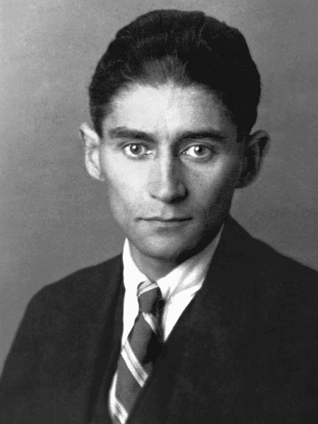 Black-and-white studio photo of Franz Kafka in suit and tie