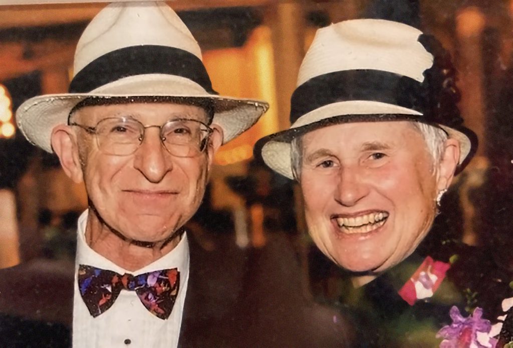 Harvey J. Sadis and Harriett M. Cody smiling in formal wear