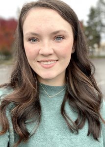 Kara Atkinson smiling, outdoors