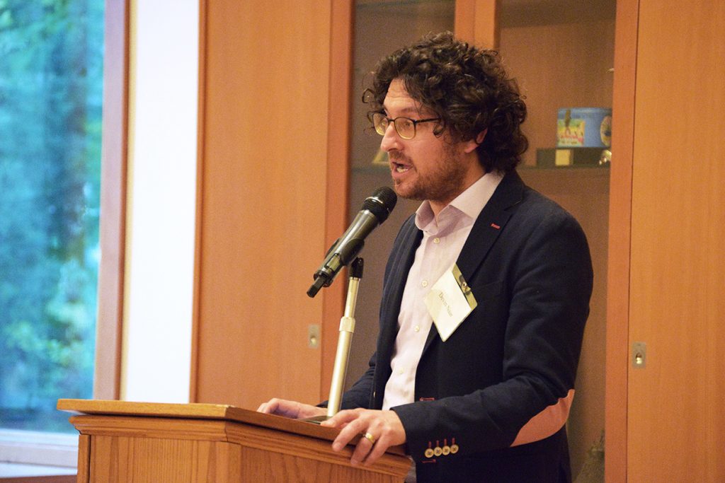 Devin Naar speaking at a public event