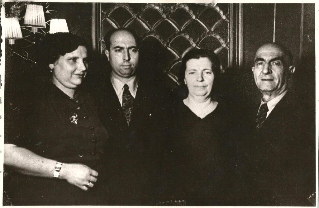 Black-and-white photo showing two couples in formalwear