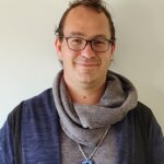 Man wearing scarf and glasses