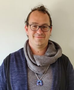 Man wearing scarf and glasses