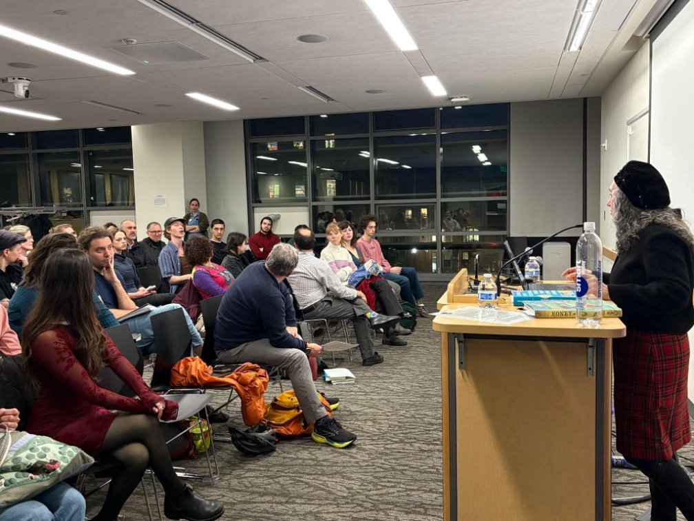 Miriam Udel answers a question from University of Washington undergraduate Brian Rocca during the lecture “Umbrella Sky – Modern Jewish Worldmaking Through Yiddish Children’s Literature” on Jan. 28. Photo by Madison Morgan