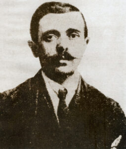 An old black and white portrait of a man in a suit.