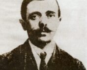 An old black and white portrait of a man in a suit.